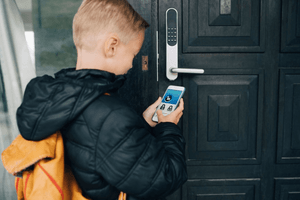 boy accessing door secured with system